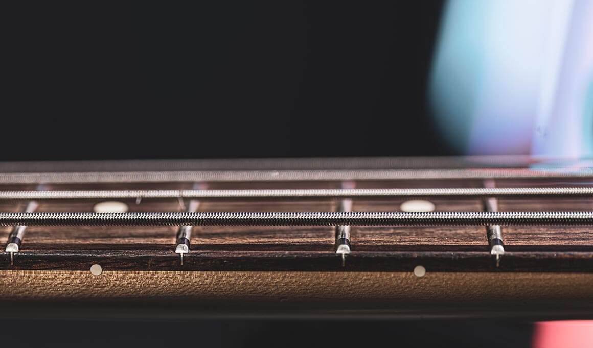 What are the origins of bass guitars