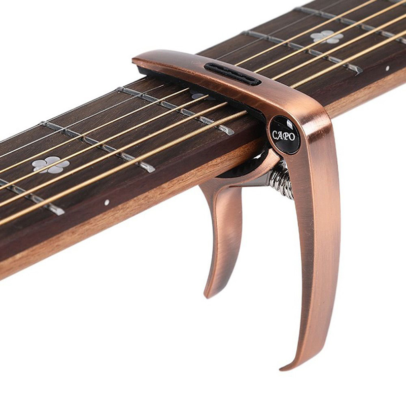 Capodastre pour guitare acoustique et électrique en metal ou bois - couleur cuivre