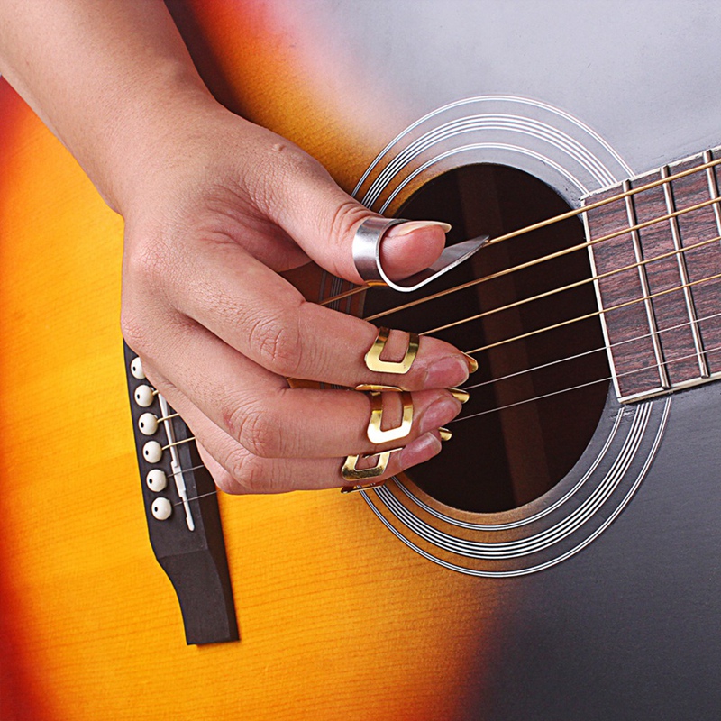 Jouer de la guitare aux doigts ou au médiator ? - Musique