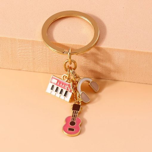 Porte-clés Guitare et instruments de Musique en métal couleur rose