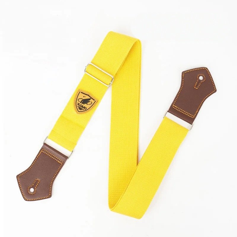 Sangle guitare unie Palette Pop coloris jaune soleil avec embouts en simili cuir brun