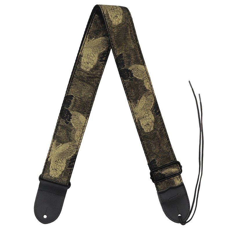 Gros plan du motif papillon doré tissé en jacquard de la sangle guitare Papillon d'Or